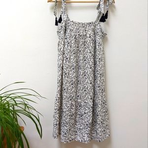 Sleeveless smocked floral mini swing dress